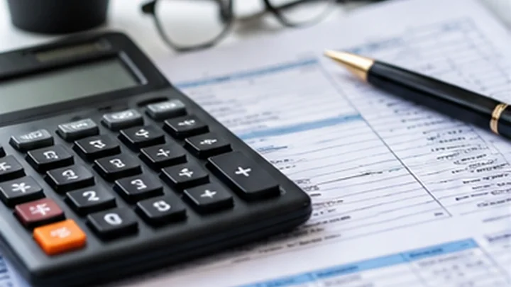 Calculator with tax invoice paperwork